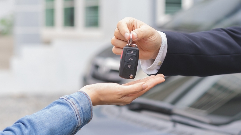 Business car rental, sell or buy service, dealership hand of agent dealer, sale man giving auto key of vehicle to customer renter, buyer young woman receiving, client or tenant, transfer automobile.